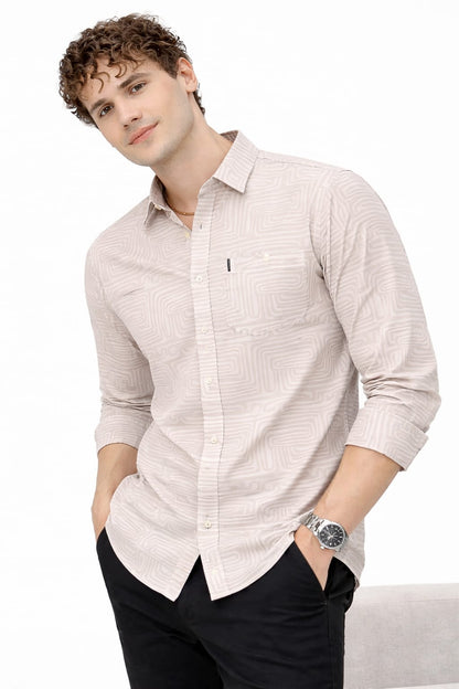 Man wearing a light-colored button-up shirt with a white background
