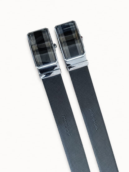 Two black belts with silver buckles on a white background